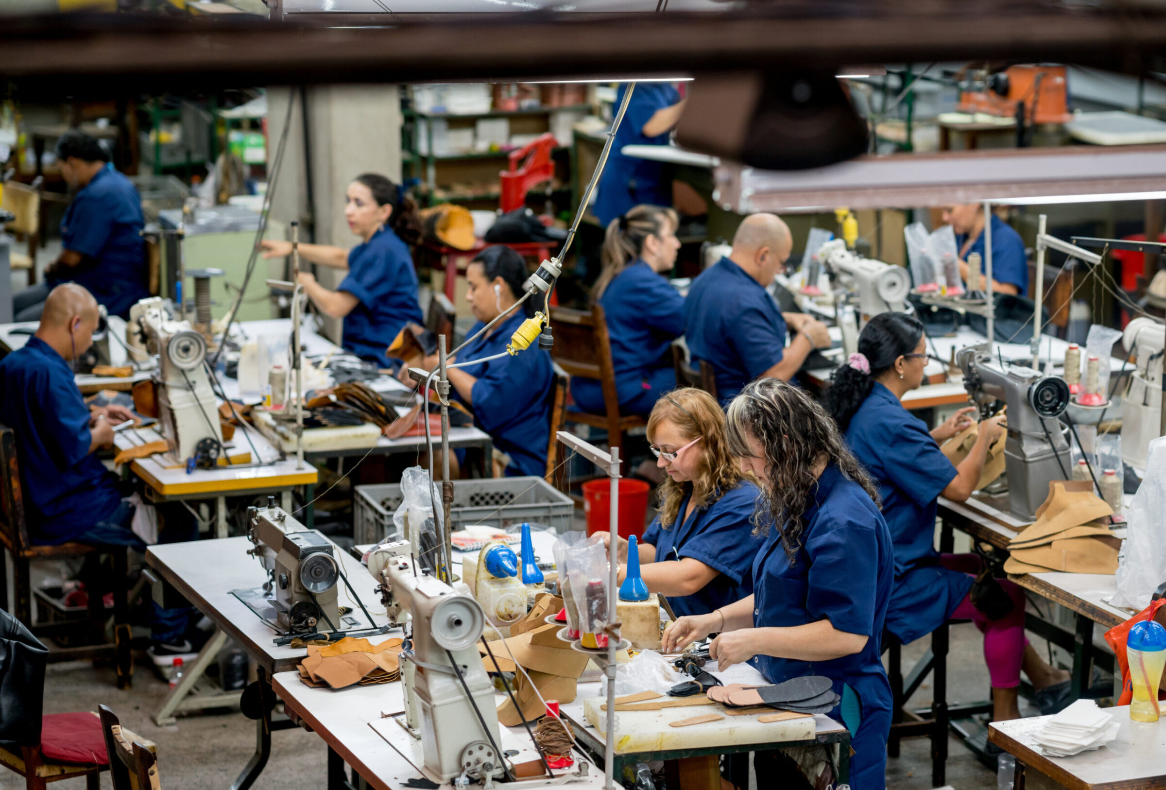 Manual workers working at a factory Agenzia per il lavoro AxL Leather